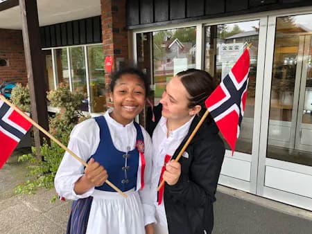 students holding Norway flags