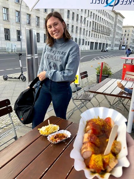 student eating currywurst